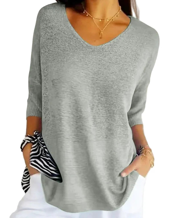 Stickad tröja med v-ringning