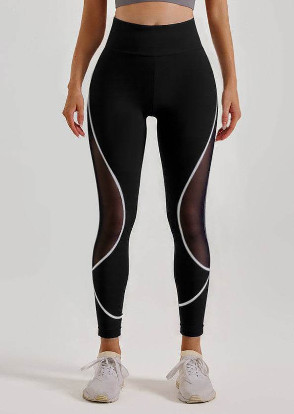 Svarta leggings med vita detaljer och mesh-detaljer
