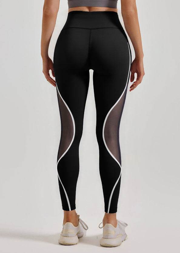 Svarta leggings med vita detaljer och mesh-detaljer