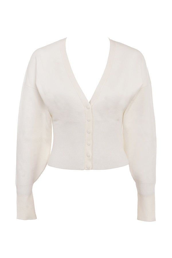 Vit stickad cardigan med V-hals och byxor