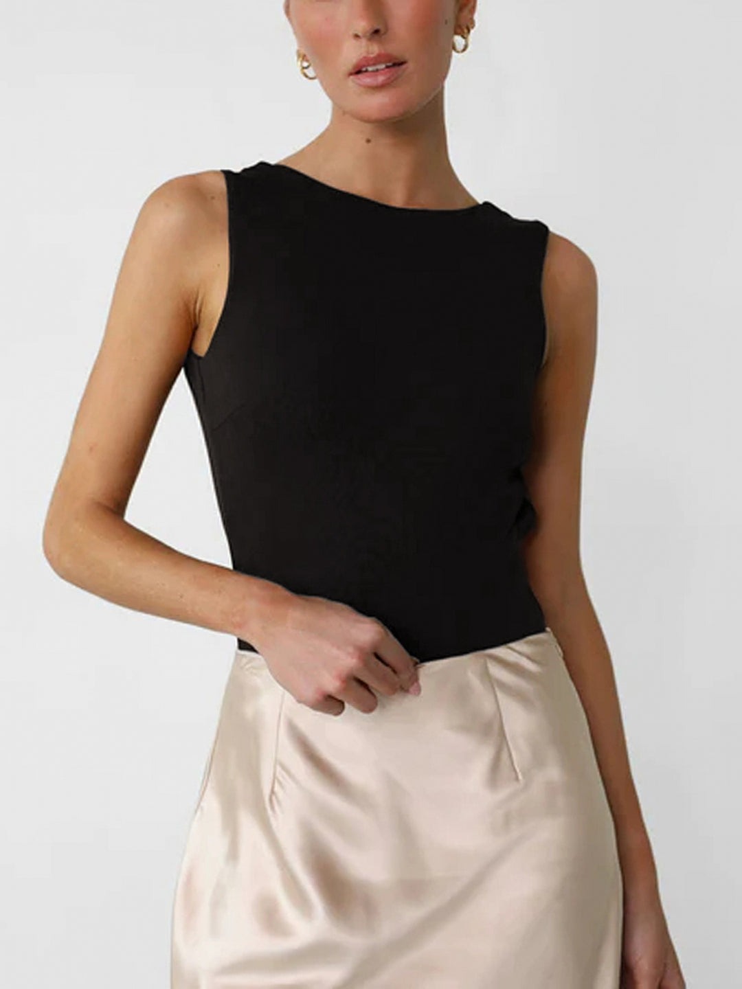 Ärmlös body med öppen rygg