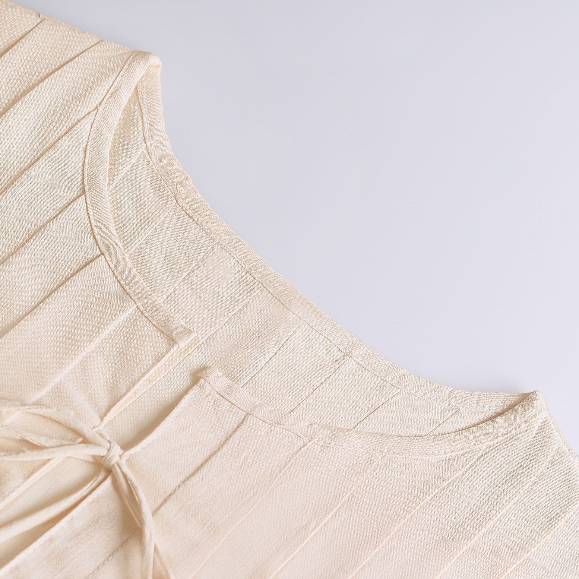 Subtil väst i bomull med snörning