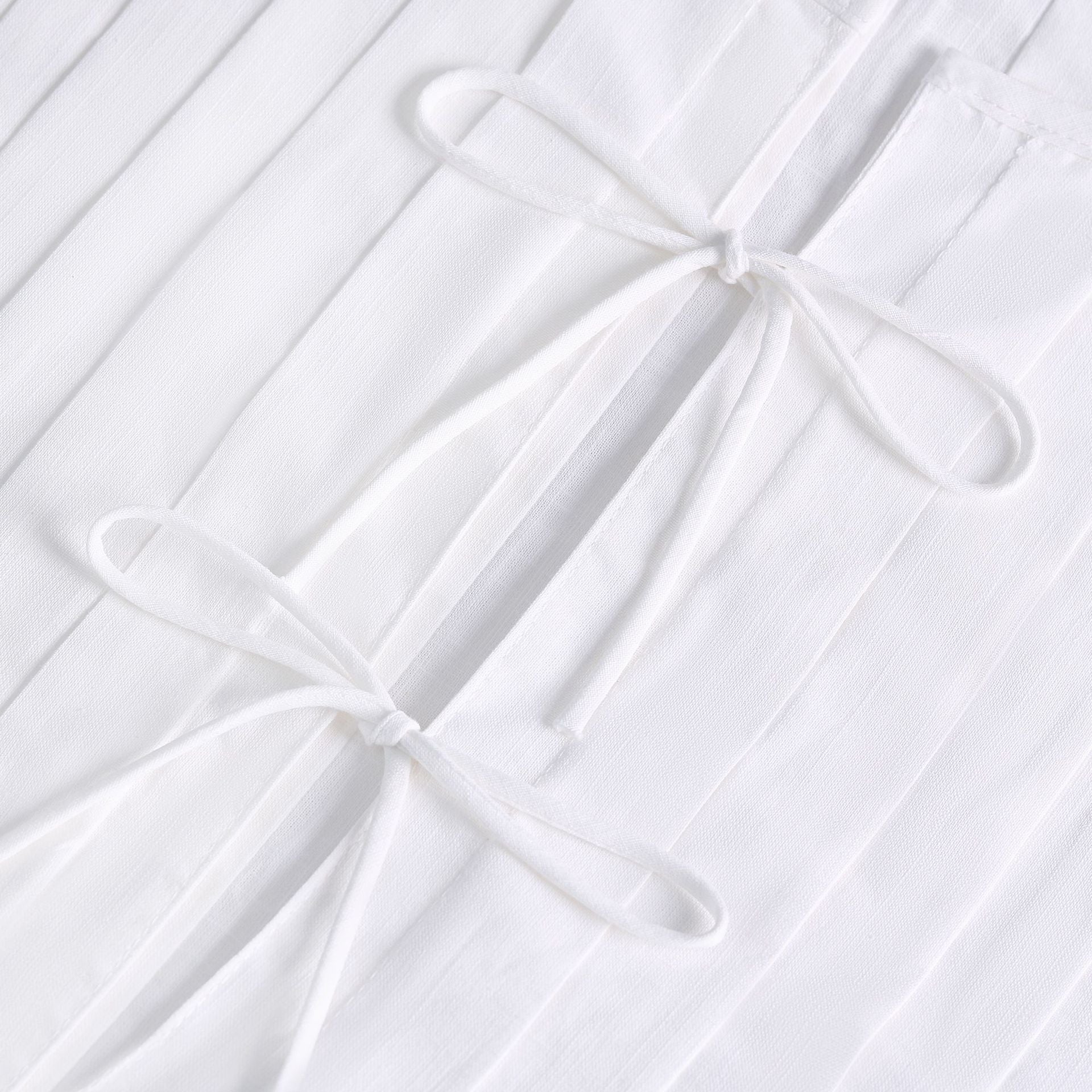 Subtil väst i bomull med snörning