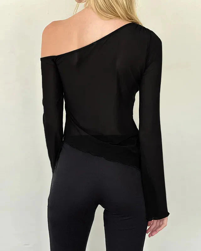 Asymmetrisk genomskinlig one-shoulder-topp