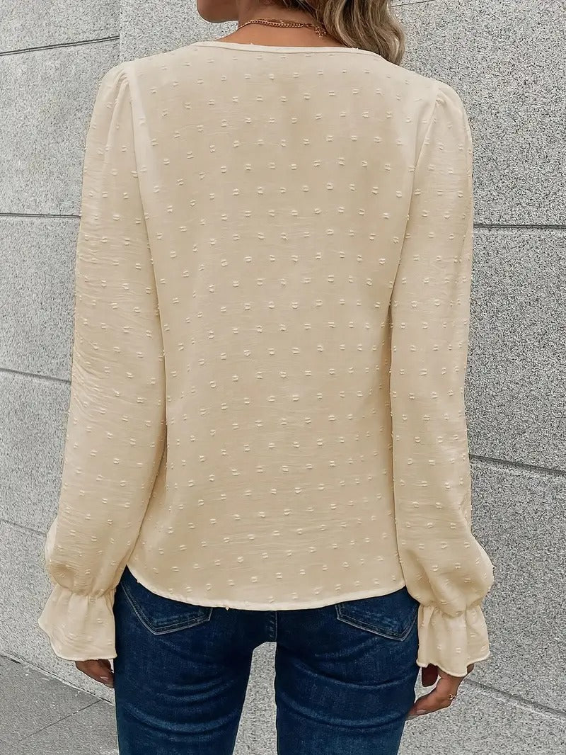 Blus med spetskant och puffärmar