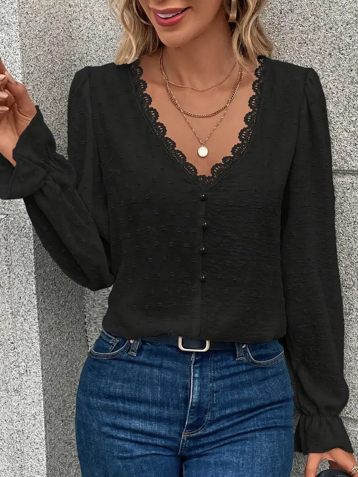 Blus med spetskant och puffärmar