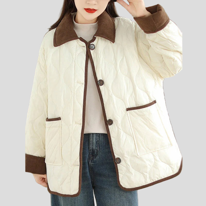 Quiltad jacka med kontrastkrage och påsydda fickor