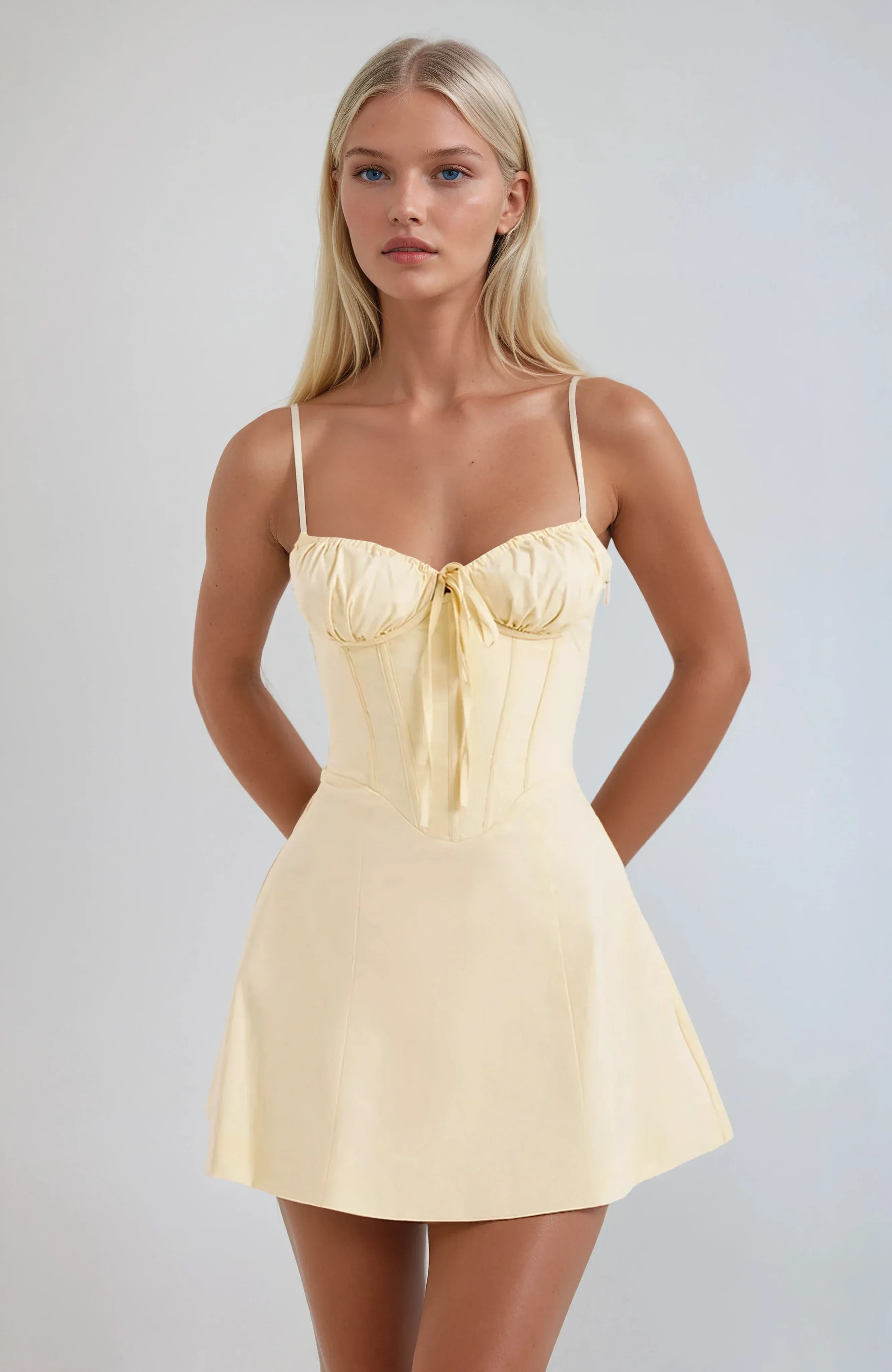 Ljusgul bustier miniklänning med rosettdetalj