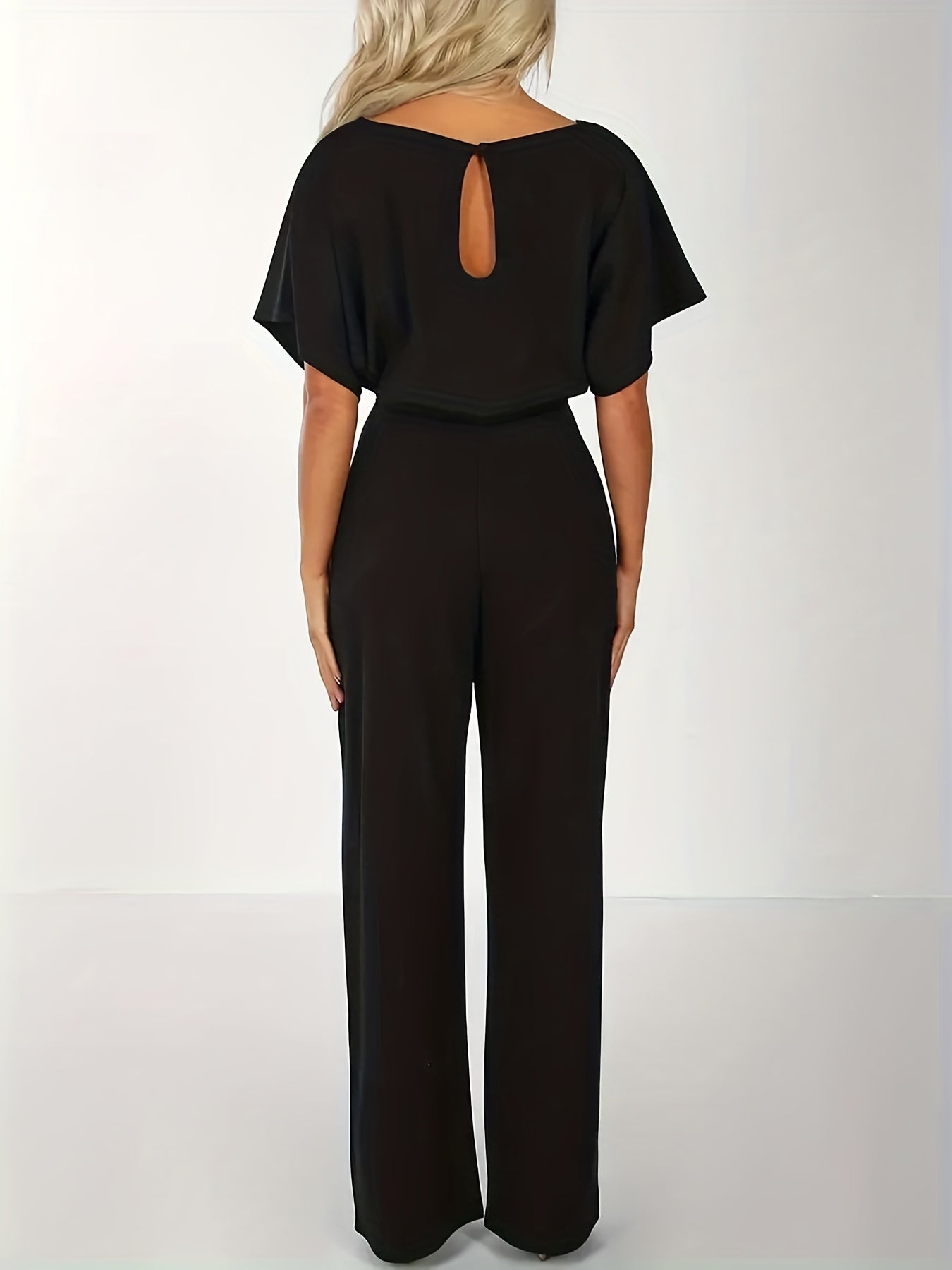 Vid jumpsuit med midjeband
