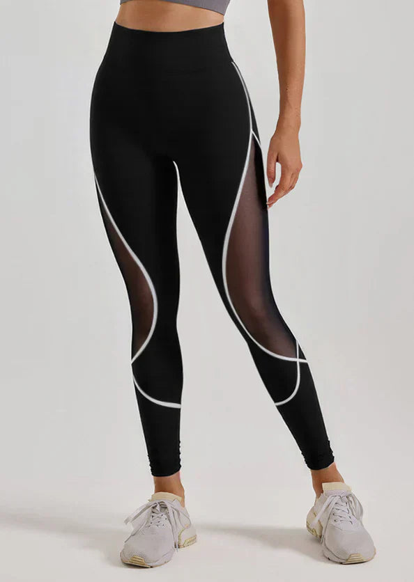 Svarta leggings med vita detaljer och mesh-detaljer