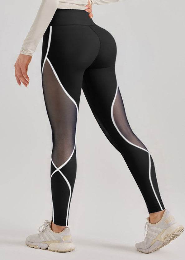 Svarta leggings med vita detaljer och mesh-detaljer