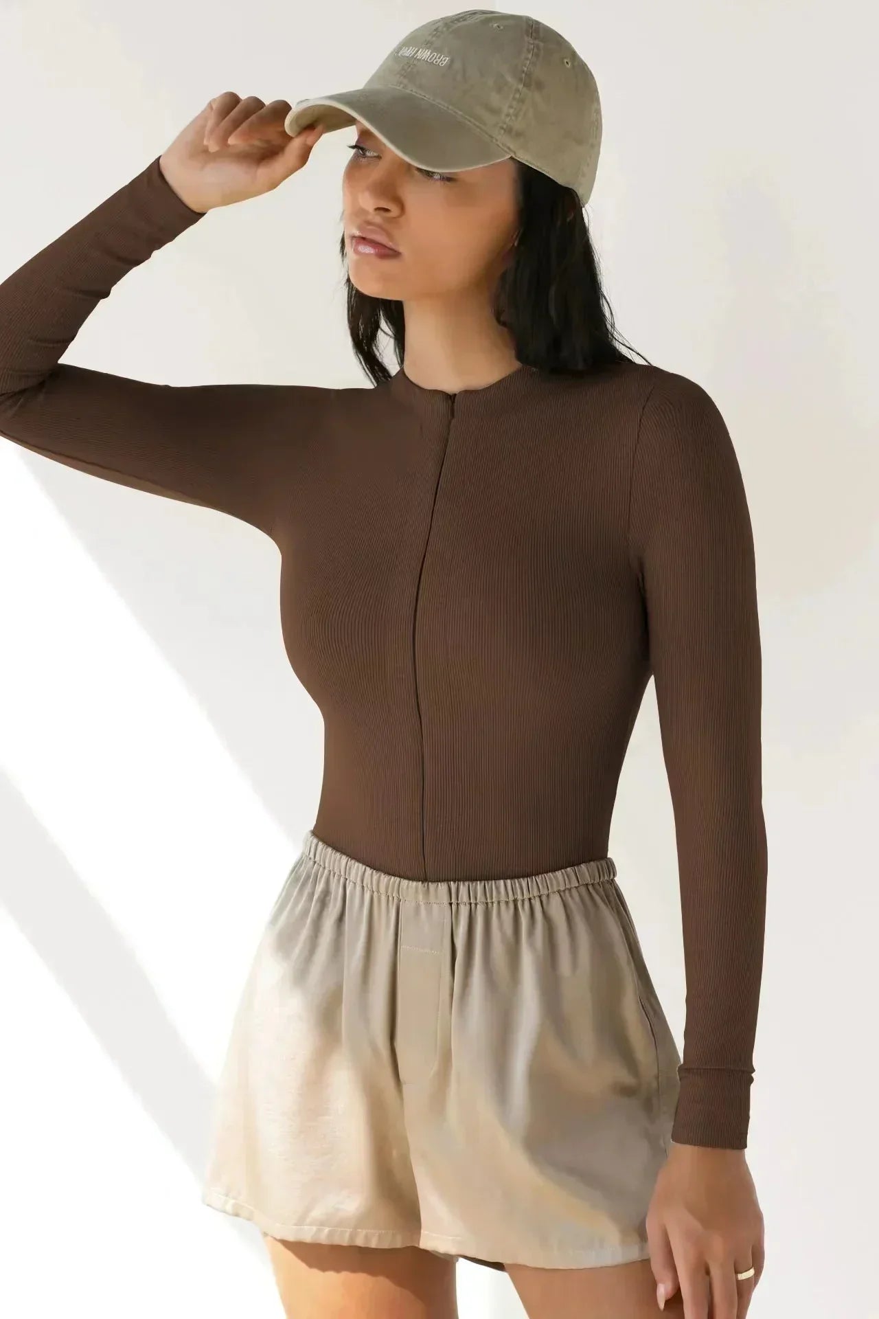 Bodysuit med dragkedja och långa ärmar