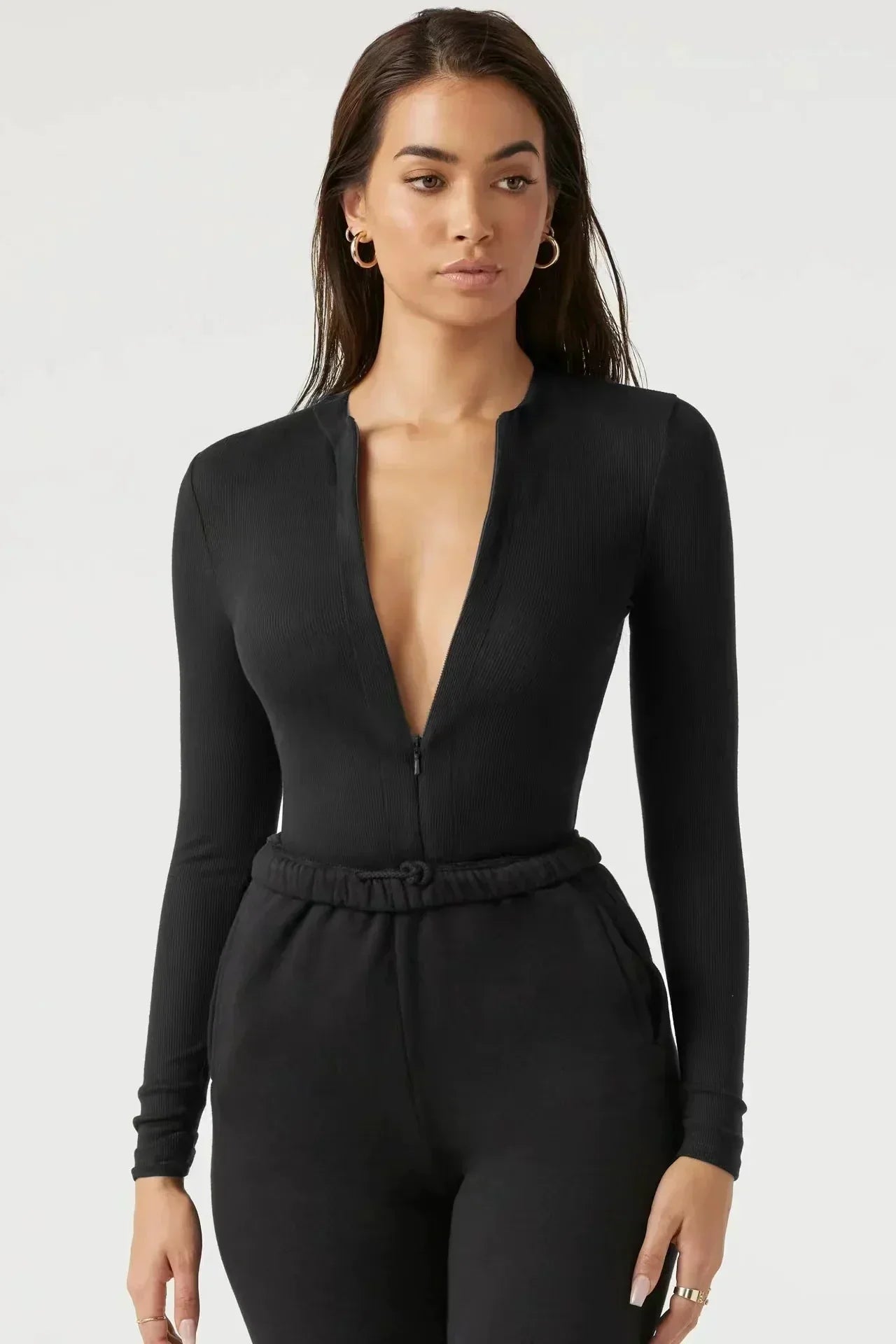 Bodysuit med dragkedja och långa ärmar