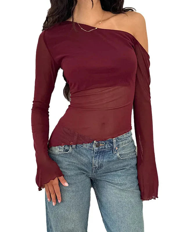 Asymmetrisk genomskinlig one-shoulder-topp