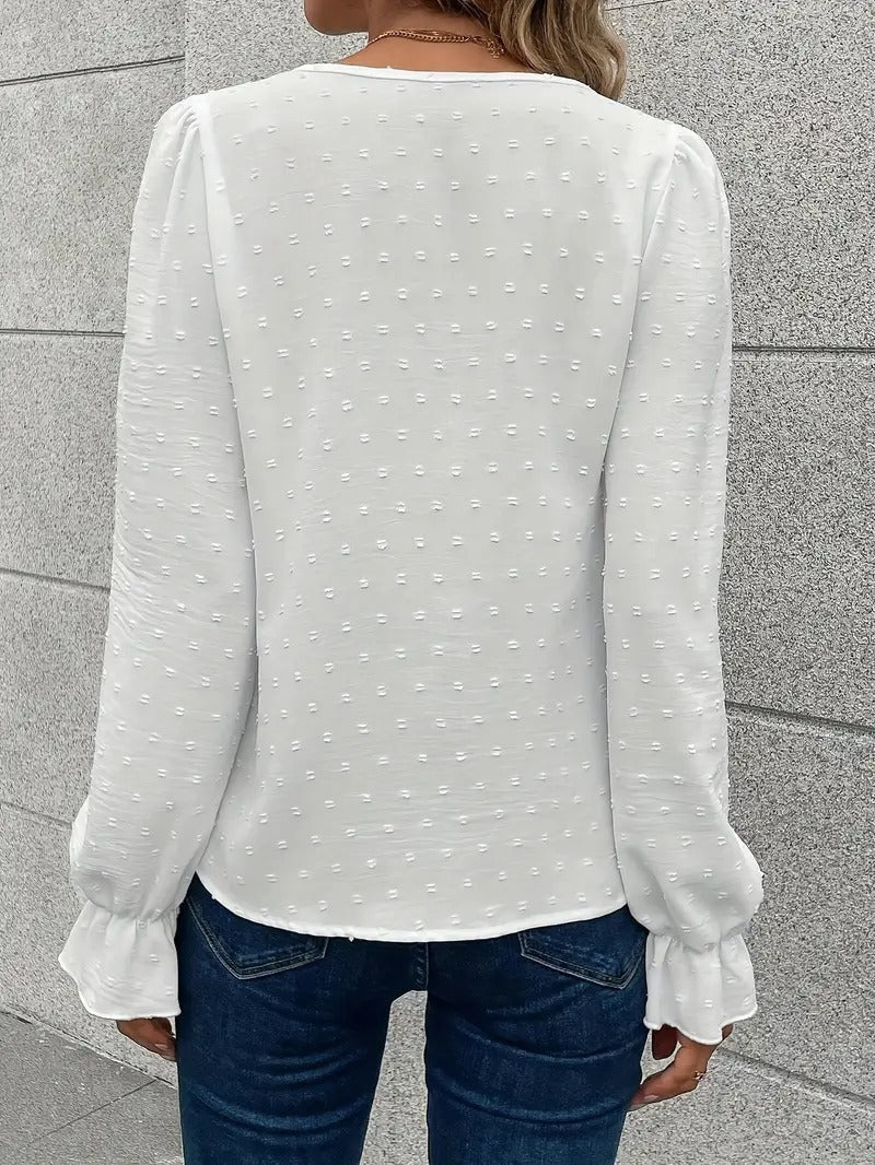 Blus med spetskant och puffärmar